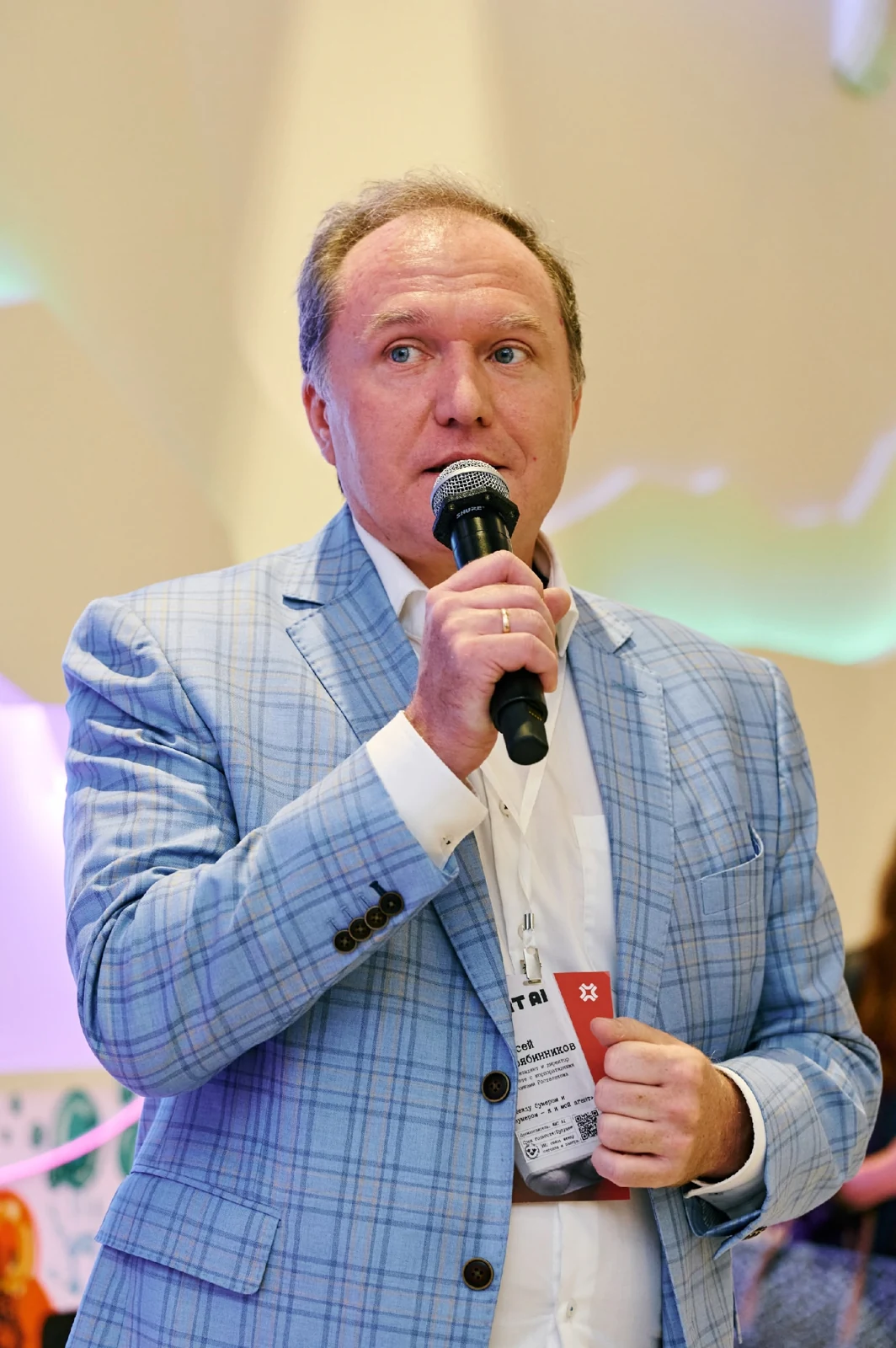 Alexey Podryabinnikov speaking at an event